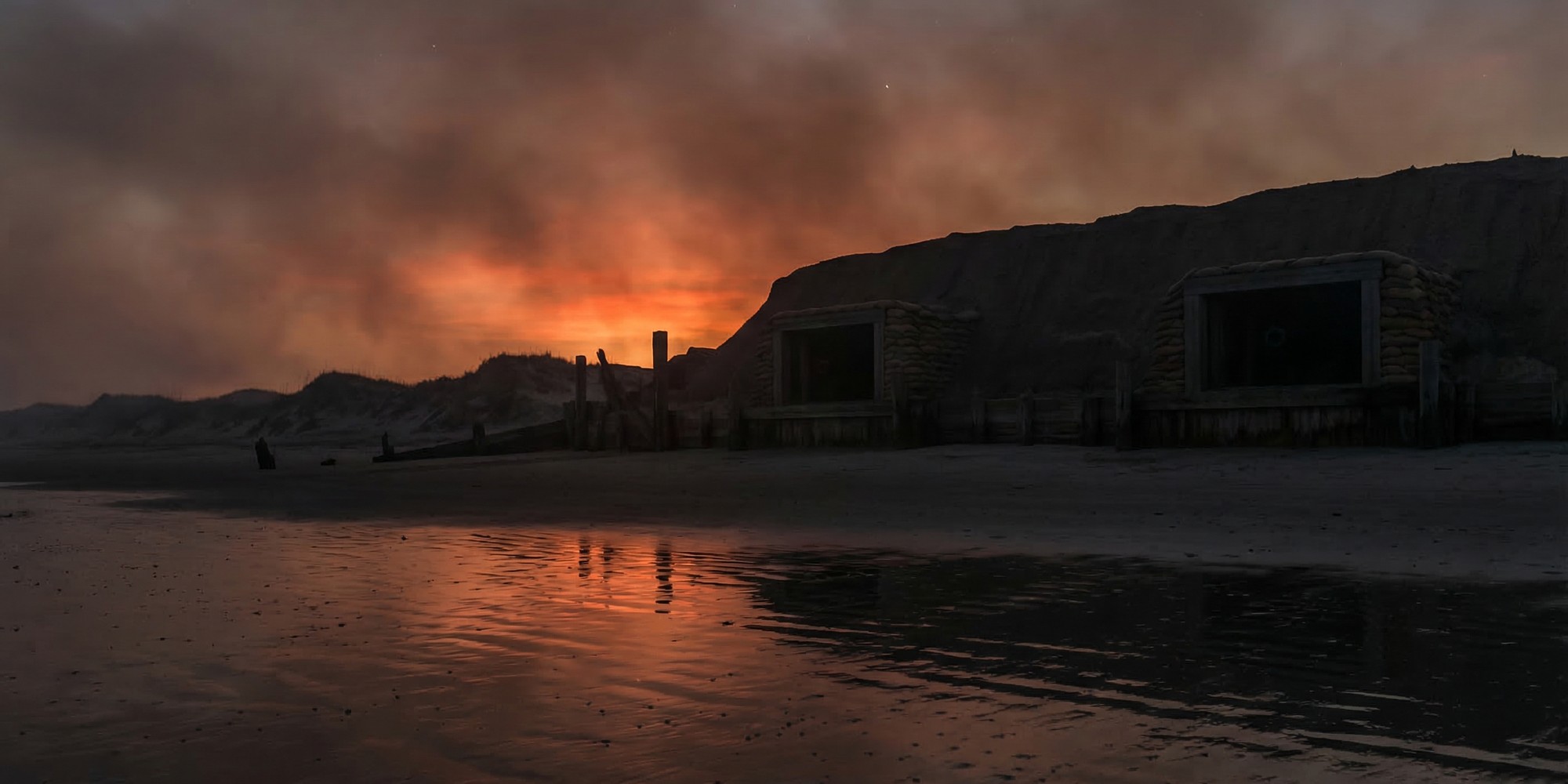 The darkened sands of Morris Island at dusk, with the massive sand-and-timber ramparts of Confederate Fort Wagner silhouetted against an orange and smoke-filled twilight sky.